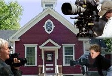 Camera People in Front of Red Schoolhouse